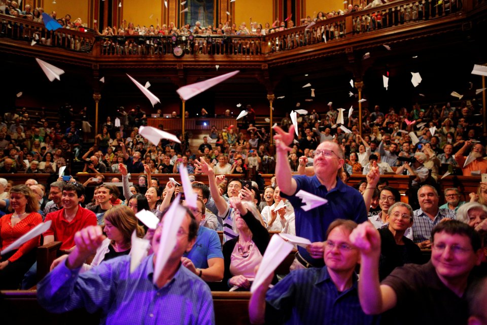 Audience members throw paper airplanes at the stage during the 26th First Annual Ig Nobel Prize ceremony at Harvard University in Cambridge, Massachusetts, U.S. September 22, 2016. REUTERS/Brian Snyder